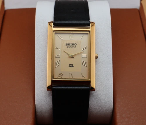 Vintage Seiko Slim Quartz Men's Wrist Watch Gold  Dial with Black Strap.