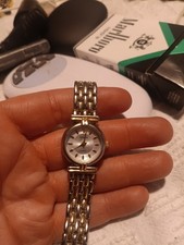 GRAL Women's Analog Wristwatch Silver Gold Metal Bracelet Polished Round Case