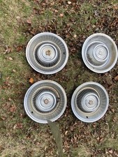 VERY NICE SET OF VINTAGE CADILLAC HUBCAPS BELIEVED TO BE 1970
