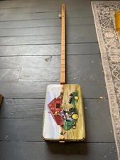 John Deere memorabilia cigar box tin guitar single string folk art