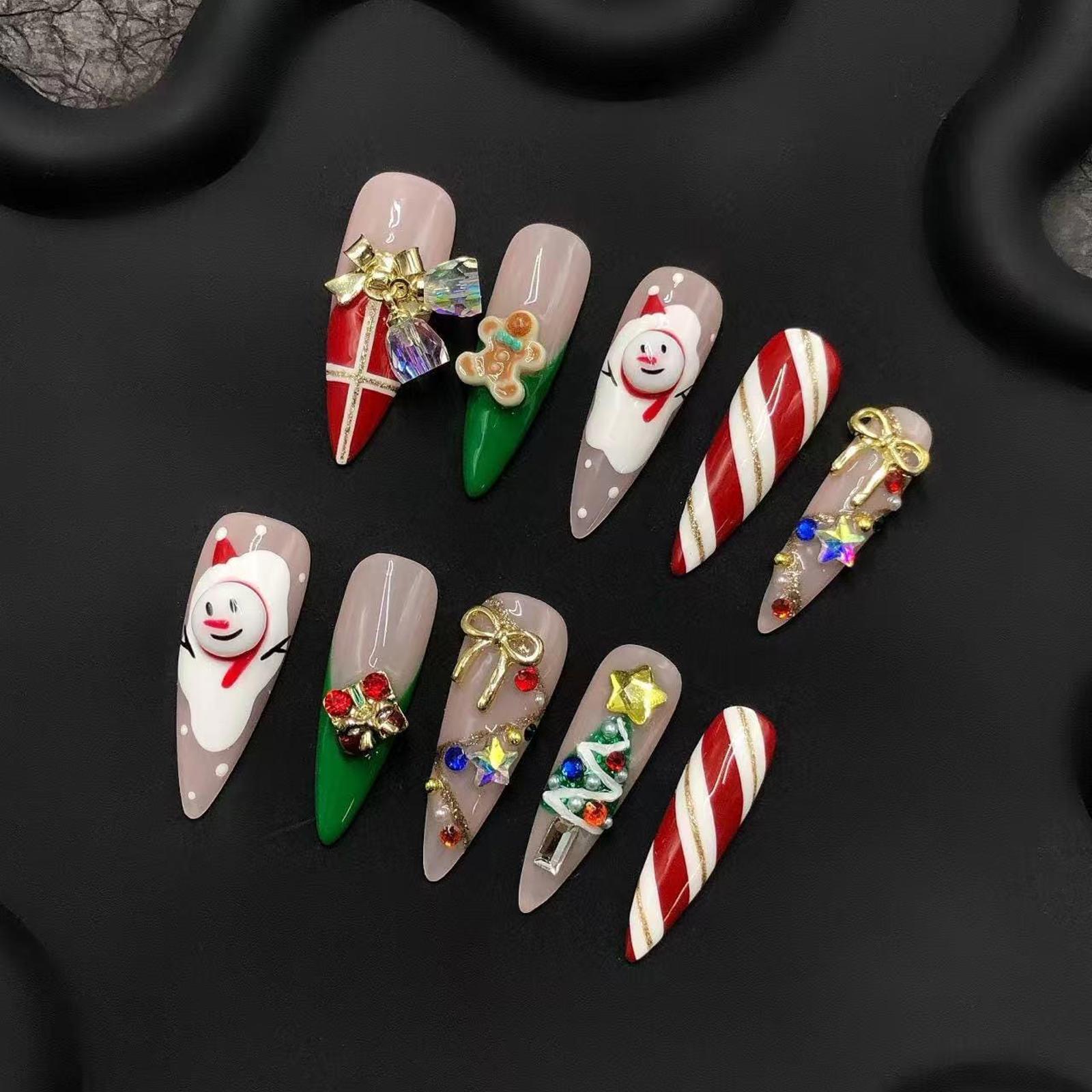 Festive 3D acrylic press-on nails with Christmas candy cane designs-image