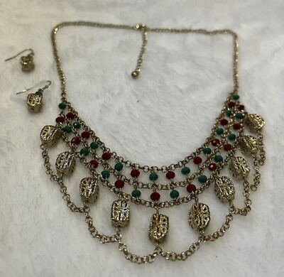 Gold Tone Kundan Style Necklace And Earring Set With Green And Red Beads .