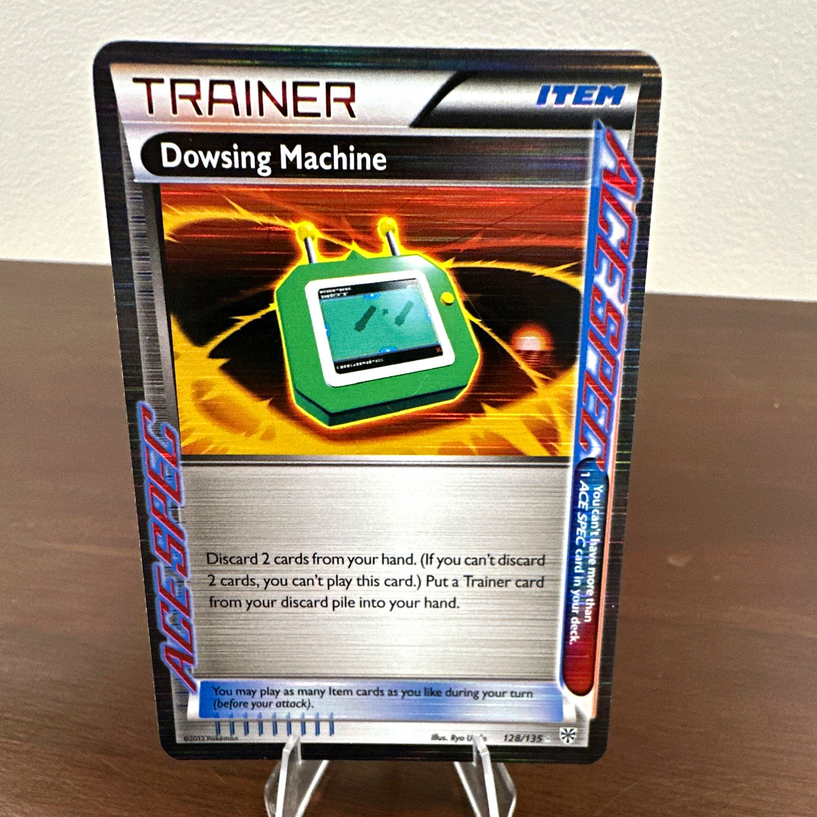 The Pokémon Company Dowsing Machine Plasma Storm 128/135 Reverse Holo EN