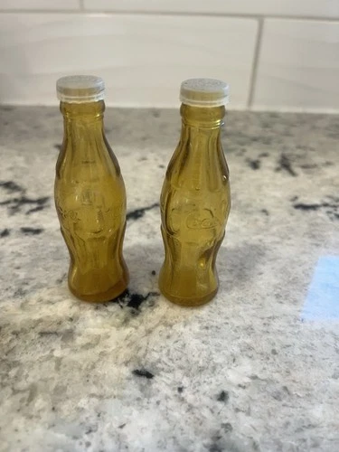 vintage miniature amber glass salt and pepper shakers Coca-Cola bottles.