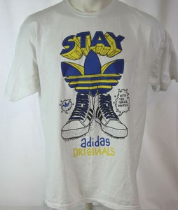 adidas the brand with the 3 stripes shirt