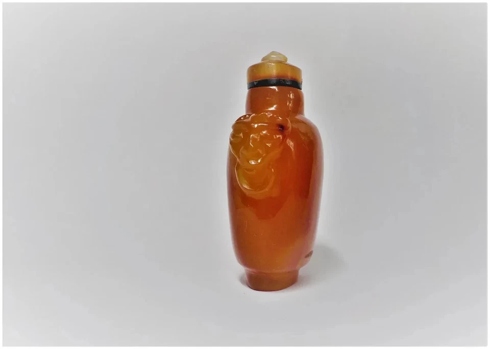 Cabeza de león tallada cornalina china vintage con anillo en la boca botella de tabaco y tapa Foto 4 de 4