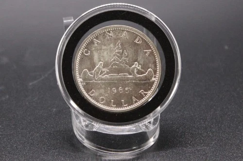 1965 Canada Silver Dollar 80% Silver weighs 23.2 grams. Voyageur Elizabeth II