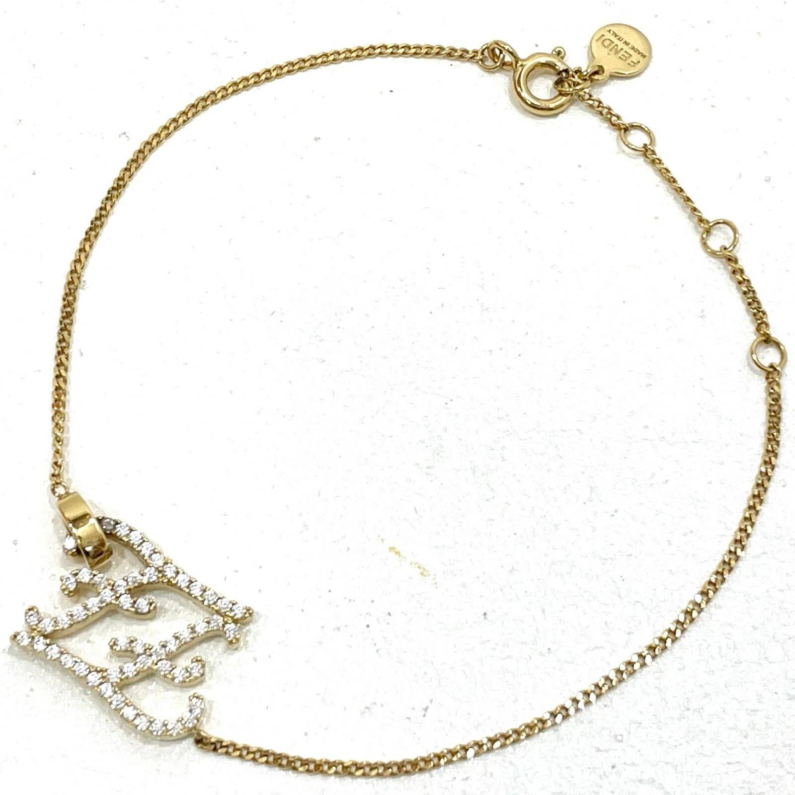 Bracciale FENDI Karligraphy metallo oro 8AH305 A44G con scatola autentico