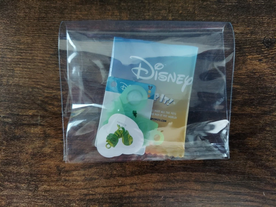 Disney Pop It! Mystery Bag Pascal RARE Mini Sensory Fidget Toy, Card & Sticker - Image 2 of 4