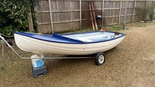 Fibreglass Dinghy with 3.5 Mercury Outboard Motor and launch trolley
