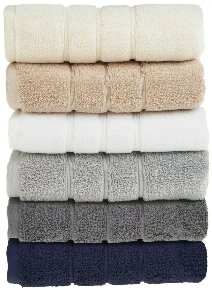 Premium Photo  Stack of clean towels on wooden table in bedroom