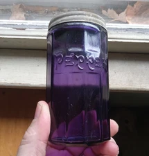 EARLY 1900 PANELED PEPPER EMB AMETHYST GLASS HOOSIER JAR WITH ORIGINAL LID