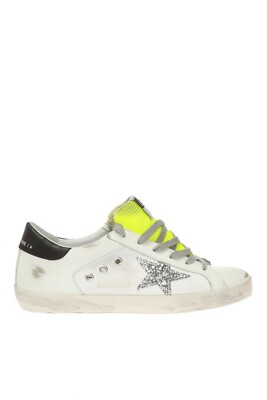 white and silver golden goose sneakers