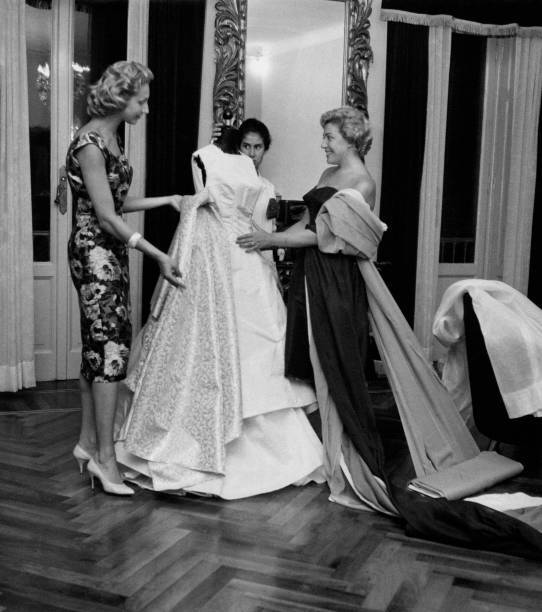 Italian singer Carla Boni watching wedding dress made dressmaker's