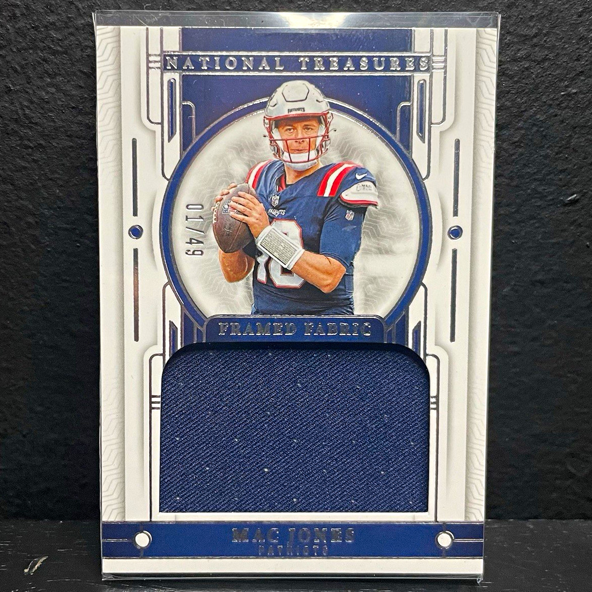 Mac Jones 2023 Panini National Treasures Framed Fabric Relic 01/10 Patriots