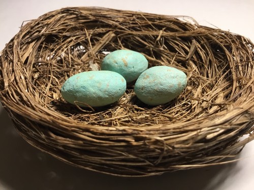 small handcrafted birds nest with 3 green speckled eggs!