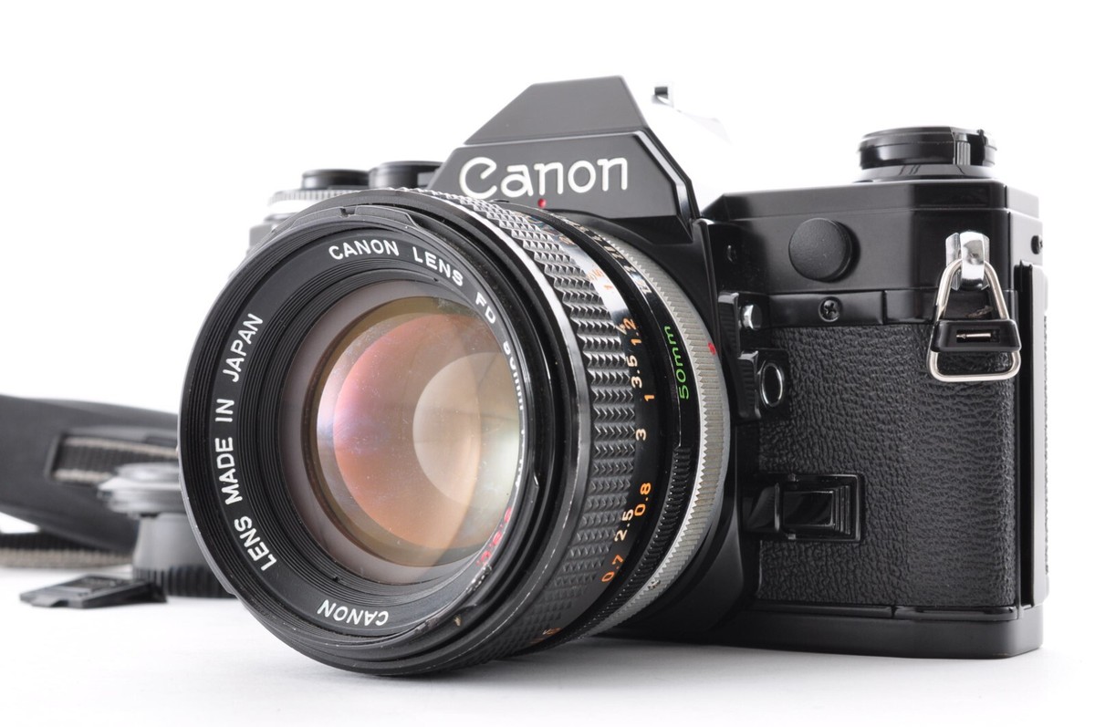 Canon AE-1 Black / Lens FD 50mm f/1.4 Excellent+5 SLR film Canon AE-1 Black / Lens FD 50mm f/1.4 Excellent+5 SLR film
