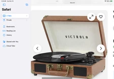 Victrola Journey vintage portable suitcase record player with built-in speakers.