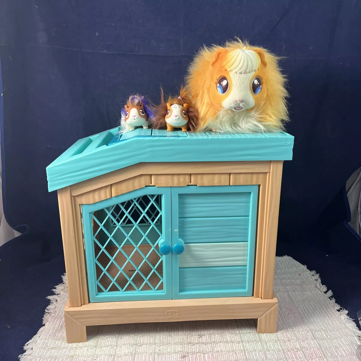 Little Live Pets Mama Surprise Soft, Interactive Guinea Pig and her Hutch,  and her 3 Surprise Babies. 20+ Sounds toy