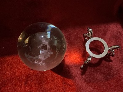 Crystal Ball with Zodiac sign Scorpio engraved inside. Silver stand.