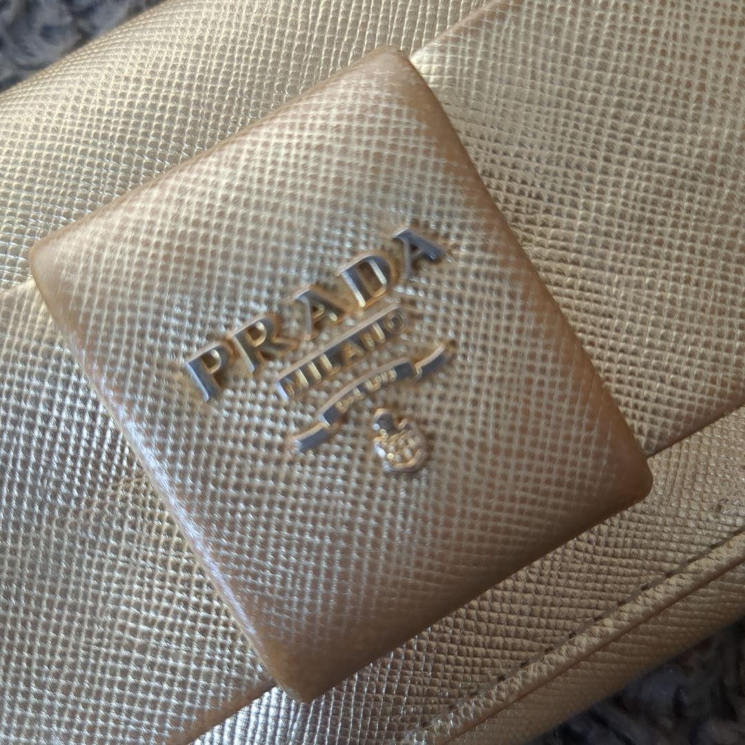 Prada Gold-Tone Ribbon Bifold Leather Wallet  