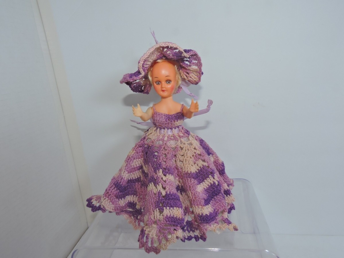 Blinking eye vintage plastic doll in purple handcrafted dress with hat