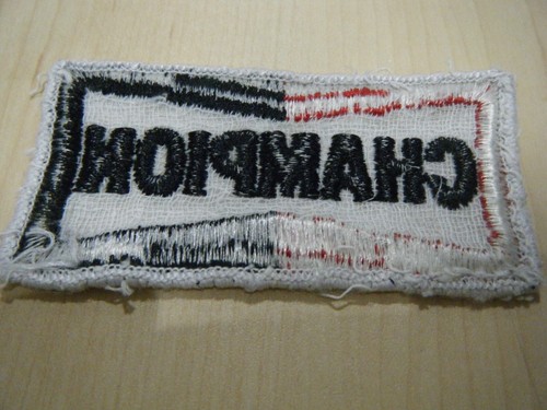 CHAMPION SPARK PLUGS PERIOD FABRIC SEW ON BADGE RARE NIGEL MANSELL SENNA PROST - Picture 2 of 2