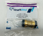 SharkBite 1-1/2 in. push-to-connect brass coupling fitting in clear plastic packaging with blue and white label.