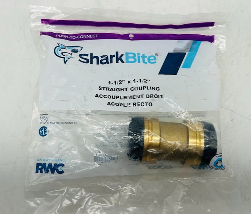 SharkBite 1-1/2 in. push-to-connect brass coupling fitting in clear plastic packaging with blue and white label.