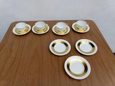 LIMOGES CERALENE A. RAYNAUD  ( 4 FLAT BOTTOM CUPS & 7 SAUCERS GOLD BAND )
