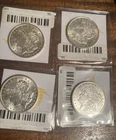 4 1921 Morgan Silver Dollars----2 lots of 2 coins are for sale.