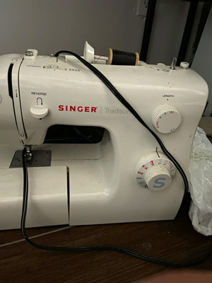 SINGER Tradition Sewing Machine works just gets caught a lot