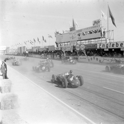Mike Hawthorn Ferrari Dino 156 #4 chases after Jack Brabham Cooper- 1957 Photo