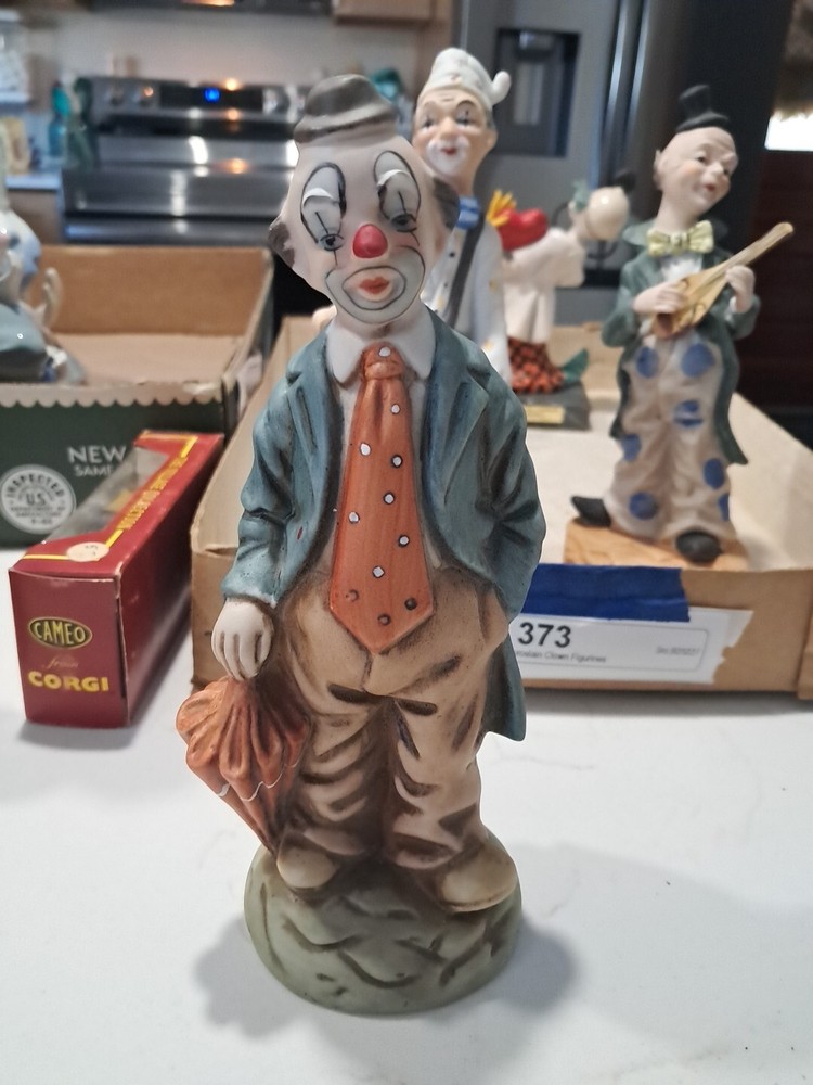 vintage umbrella clown figurine