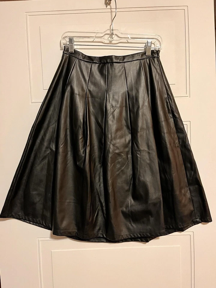 Falda de fiesta de cuero sintético negra talla 4 cremallera lateral longitud media forrada estilo elástico Foto 3 de 4
