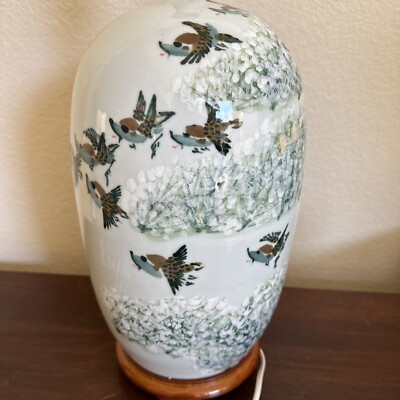 A PAIR OF FAMILLE ROSE 'SWALLOW AND PRUNUS' VASES, 20TH CENTURY Christie's