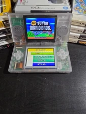 Glow-in-the-Dark Clear DS Lite + New Super Mario Bros (Japan) – Clean Reshell