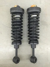 NEW PAIR of LEACREE STRUTS 552236100, POSSIBLY FOR FORD F150