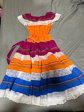 This is a vibrant traditional folk dress featuring colorful tiered layers