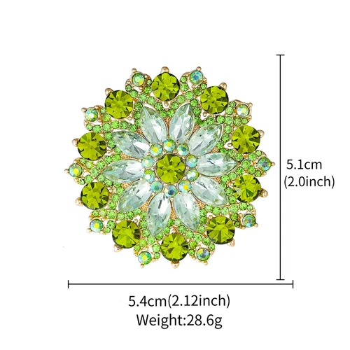 Gold-tone round brooch with green rhinestones in floral pattern, 5.4cm diameter, 2.86g weight.