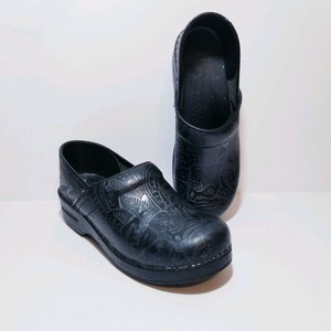 dansko black tooled leather clogs