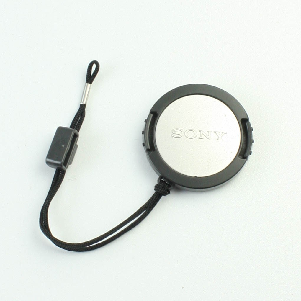 - Snap-in Front Lens Cap With Strap