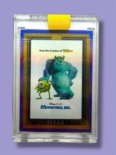 💥MONSTERS INC WALL ART /15!💥PURPLE 2025 PIXAR GOLD TOPPS CHROME ENCASED CARD!