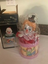 Porcelain moving head musical clown coming out of the drum NEW in box