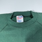 Dark green vintage Hanes Kitty Hawk sweatshirt, size XL, with black neck tag and white printed inner label.