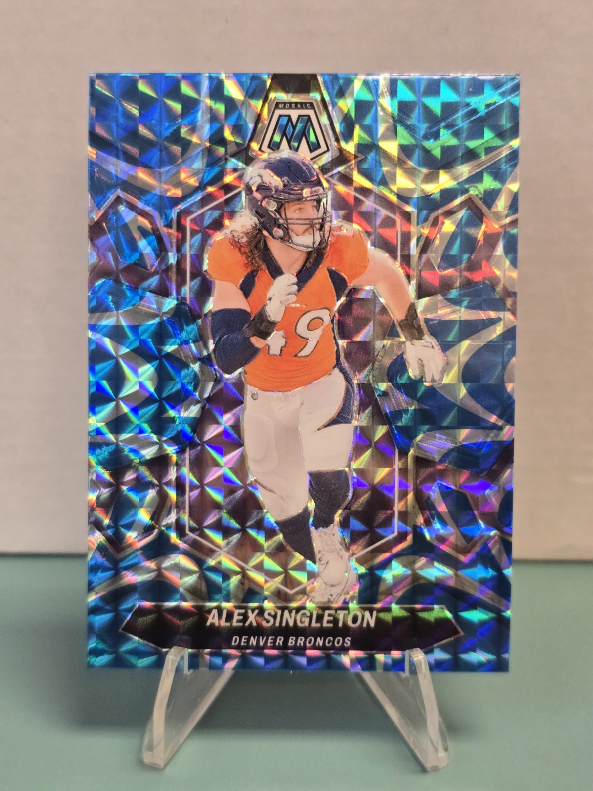 2024 Panini Mosaic Alex Singleton Reactive Blue #69 Denver Broncos