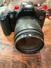 vintage Canon EOS Rebel XS 35mm film SLR camera with 35-80mm zoom lens