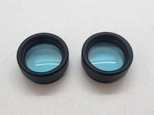 The lenses of the photofilter attachment are blue, probably binoculars