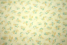 SPRAYS OF YELLOW FLOWERS ON PALE YELLOW - 100 COTTON FABRIC