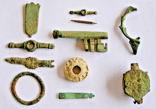 Group of 2 strap ends spindal whorl Half medieval key 3 bar mounts Brooches etc
